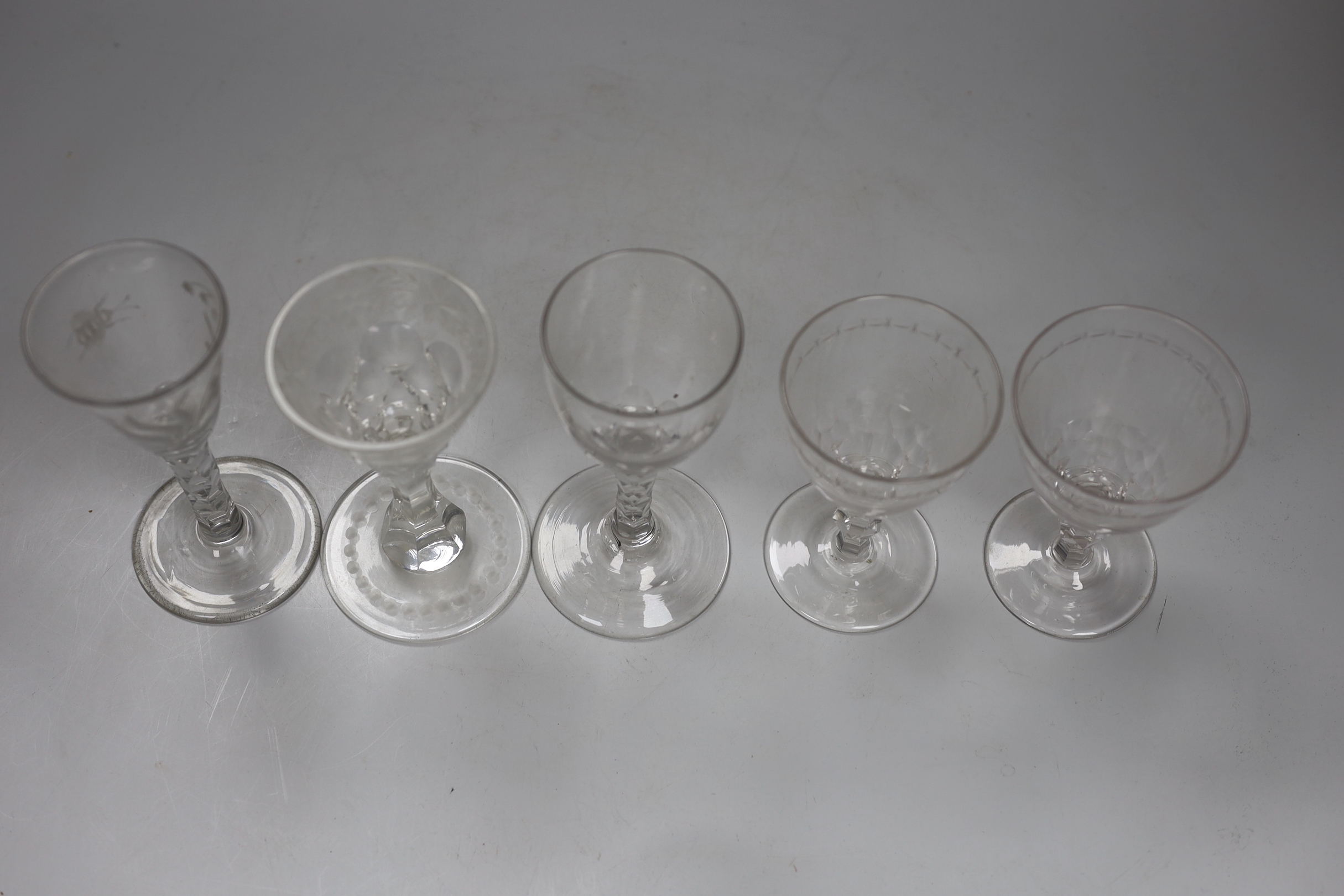 Two George III facet stem wine glasses and three other drinking glasses, tallest 15cm high (5)